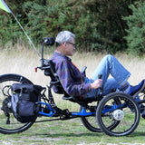 A picture of a man riding a recumbent trike