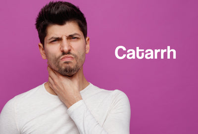 A man in a white t-shirt is holding/rubbing his throat with his left hand – he looks as though he is in some discomfort. The word – Catarrh – can be seen