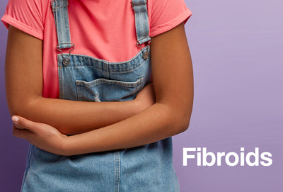 The torso of an African-American woman – she clutching her stomach, although in pain. The word – Fibroids – is visible