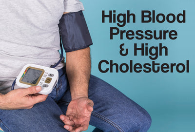 A man is sitting down. His left arm has a blood pressure cuff on it. In the man's other hand is the actual blood pressure machine. The words – High Blood Pressure & High Cholesterol – can be seen