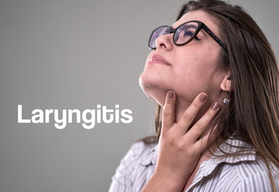 A woman clutches her throat; it looks sore. The word – Laryngitis – can be seen
