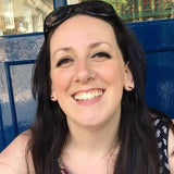 A face pic of a happy, smiley Rebecca