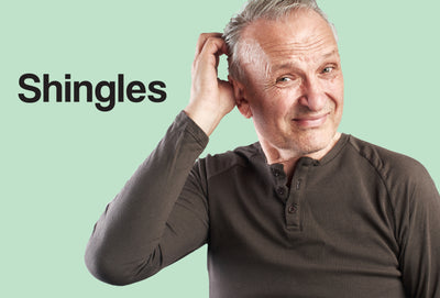 A middle age man wearing a dark brown polo type of shirt. The man is scratching the area around his right ear - the man doesn't look happy! The word – Shingles – can be seen
