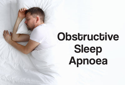 A man lying on his side in a bed and is fast asleep. The words – Obstructive Sleep Apnoea – are visible