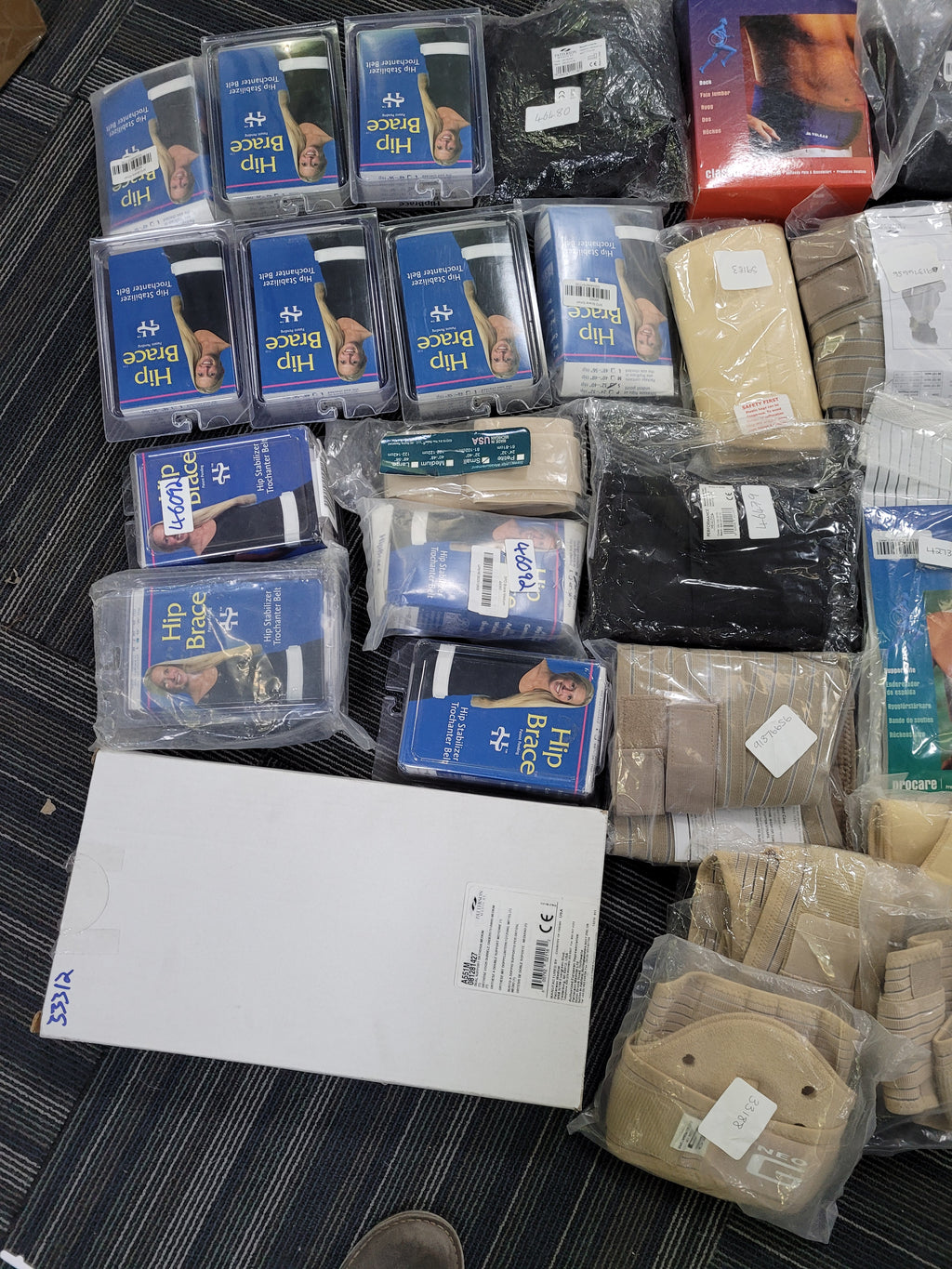 Job lot of assorted back braces and supports