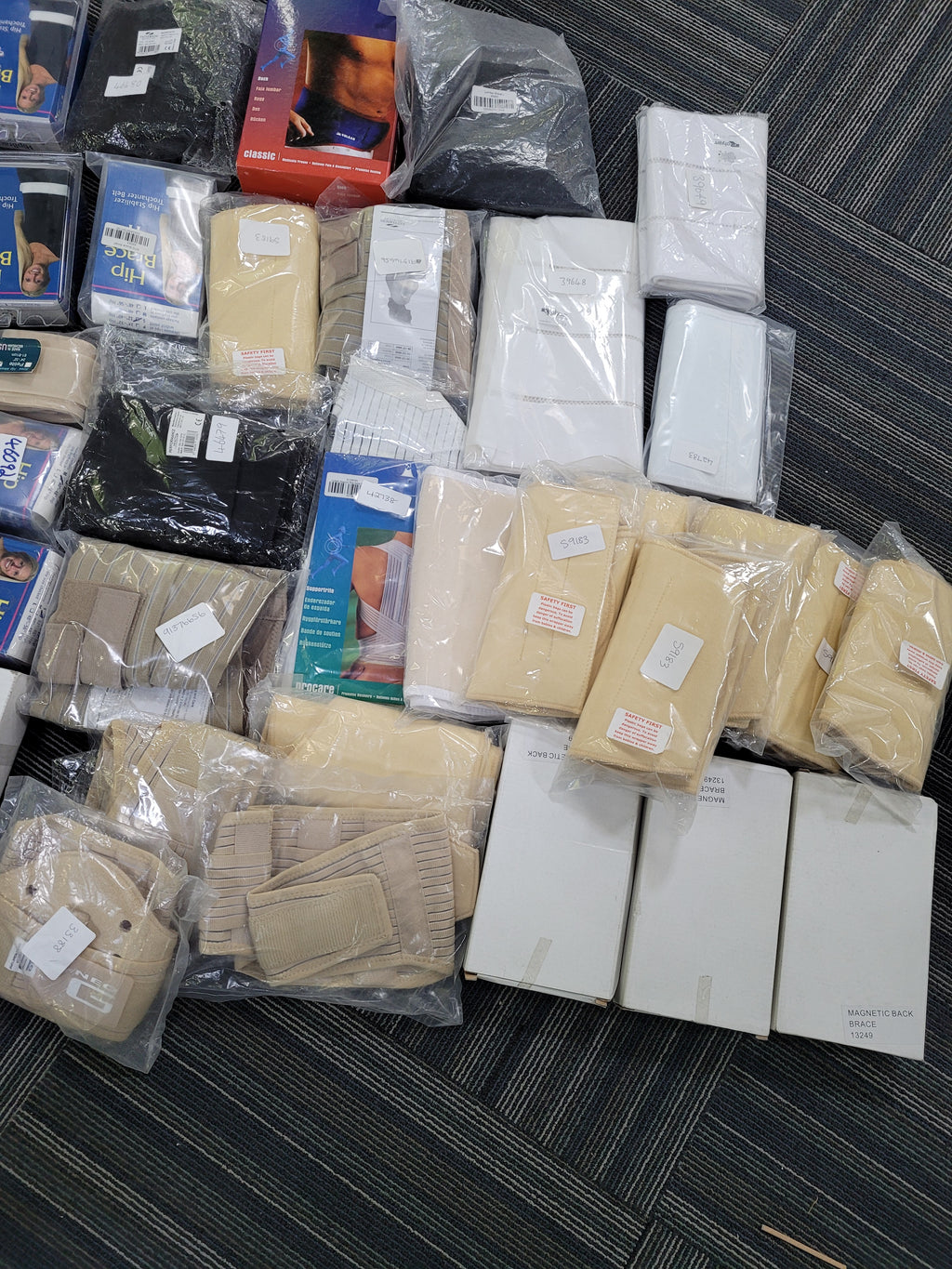 Job lot of assorted back braces and supports