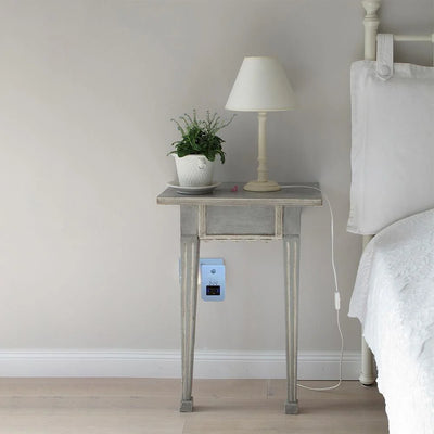Lifemax Night Light Air Purifier in home, under a bedside table