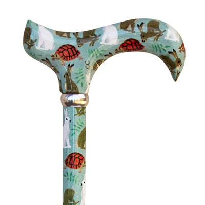 The image shows a close up of the handle on the hare and tortoise classic derby cane