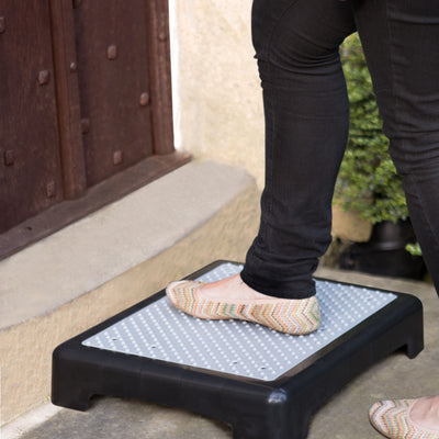 Someone putting their foot on the Outdoor Step