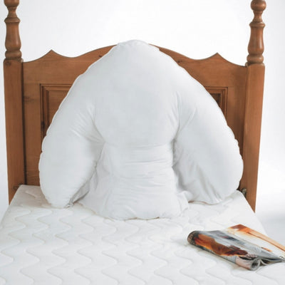 shows the harley batwing pillow on a bed