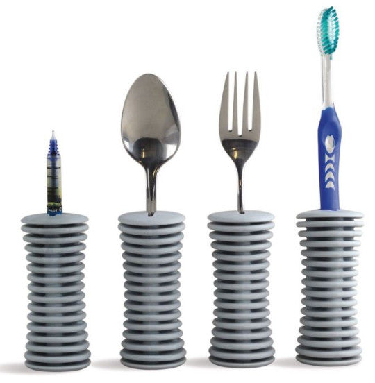 shows four universal built-up handles holding a pen, a spoon, a fork and a toothbrush