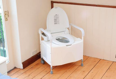 shows the dignity commode in the corner of a room