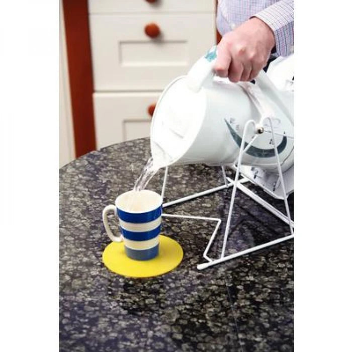 Picture of Dycem Anchorpads in use to protect surface while pouring tea