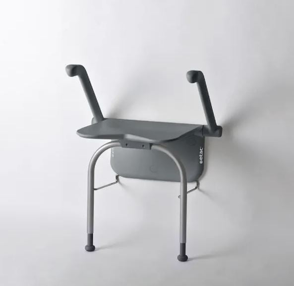 A grey Etac Shower Seat with the arms in an upright position