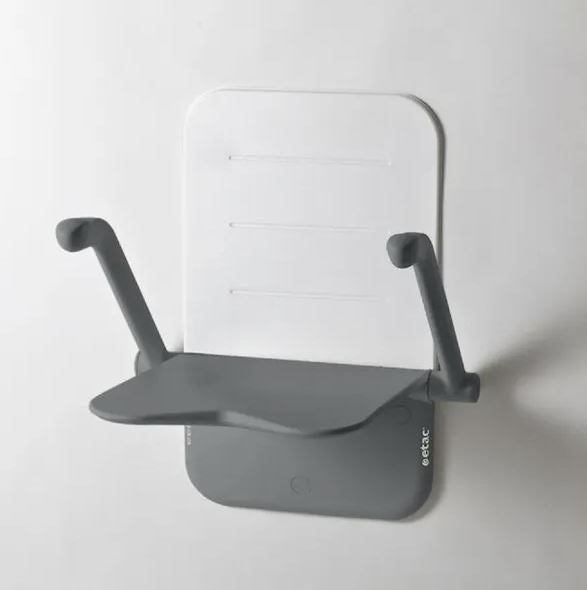 A grey etac relax shower seat with the arms in an upright position