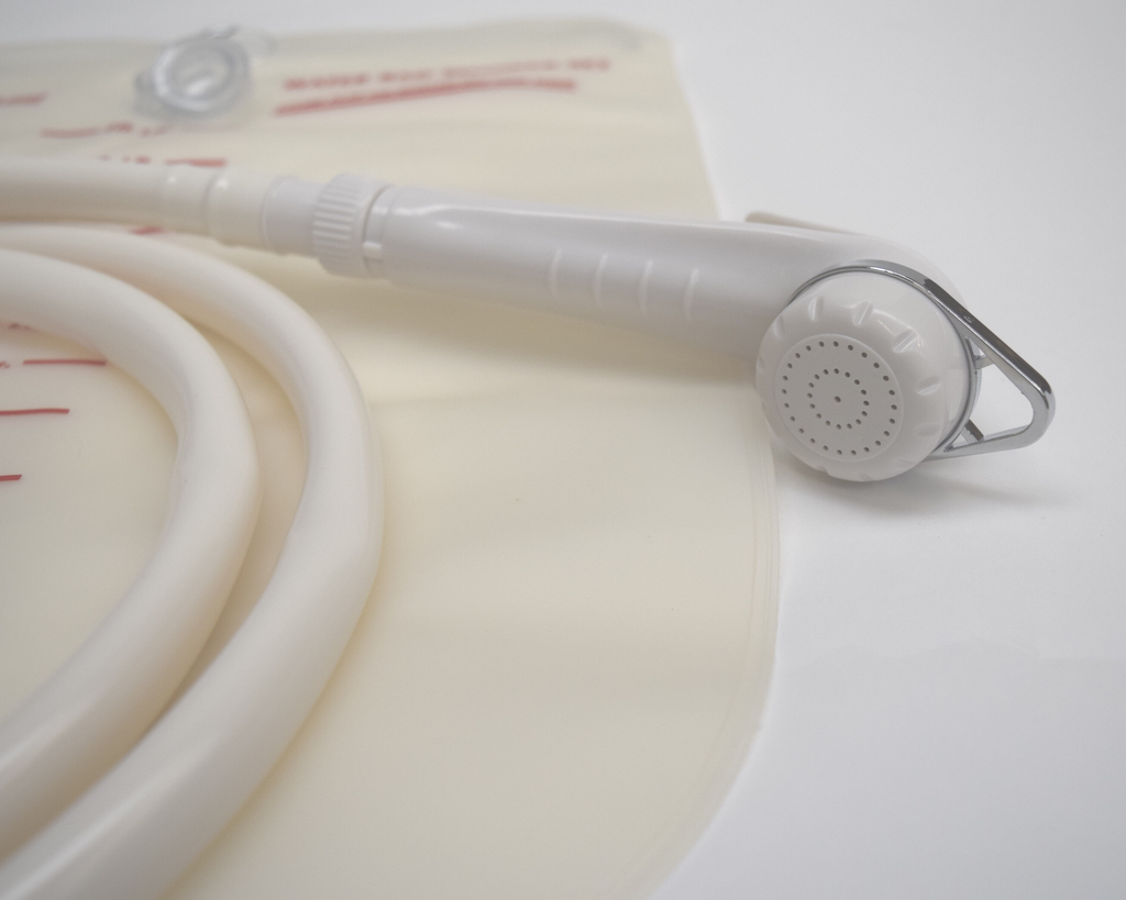 shows a close-up of the shower head nozzle on the Water Bag Shower Set