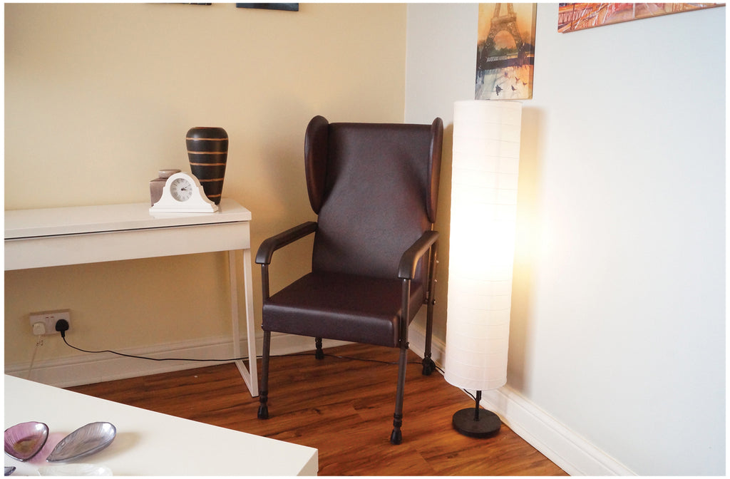 shows the brown flat pack chelsfield high back chair in a room