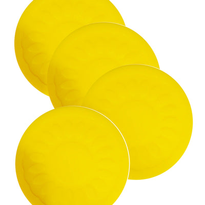 shows four yellow non slip coasters