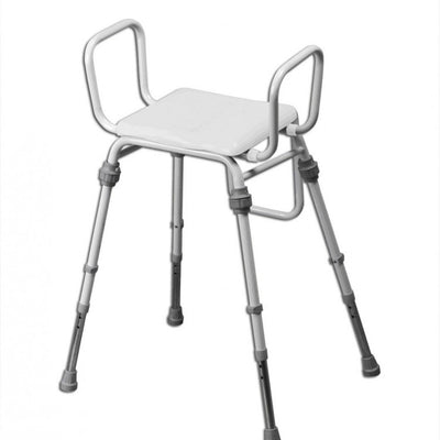 shows the compact modular perching stool with arms