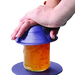 Someone using the Dycem Jar Opener to open a jar of marmalade