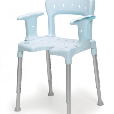 The image shows a blue Etac Swift Shower Chair