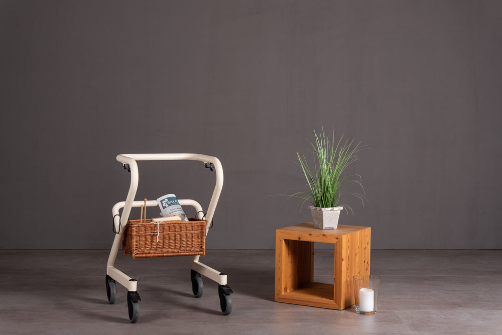 The image shows the wicker basket fitted to the lower section of the Page Indoor Rollator frame