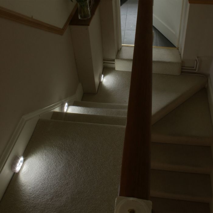 the image shows a staircase from above, which is illuminated by three lifemax LED wireless lights