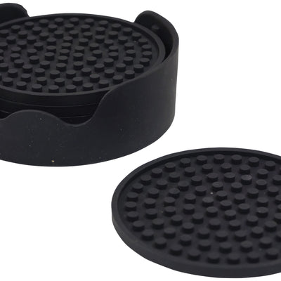 shows the non-slip silicone table coaster stacked in the holder with one out on a table