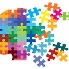 A picture of a head which is made up of many multi-colour jigsaw pieces. Some of the jigsaw pieces are breaking away from the head