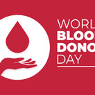 An illustration of a hand with a large drop of blood above it, along with the words – World Blood Donor Day