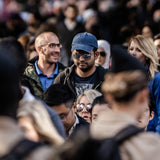 A very large crowd of people – all different ages – men and women
