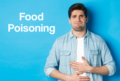 An image of a man in a blue shirt holding his stomach in pain – the words – Food Poisoning – can be seen