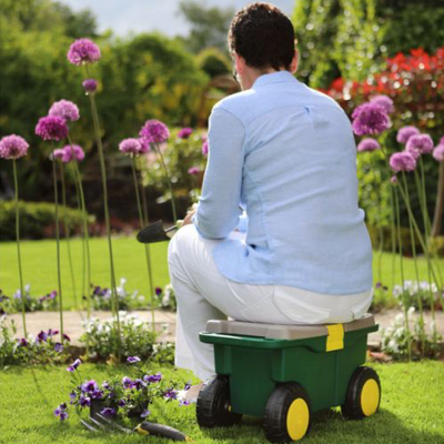 A picture of a woman sitting on one of the rollers available for sale from the Ability Superstore website 