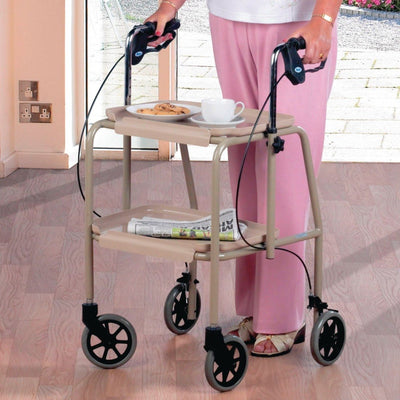 Woman walks with wheeled dining trolley walker