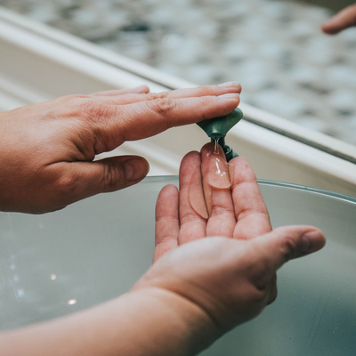 a person using hand sanitiser