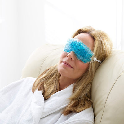 Blonde woman wearing Therapearl cooling eye mask