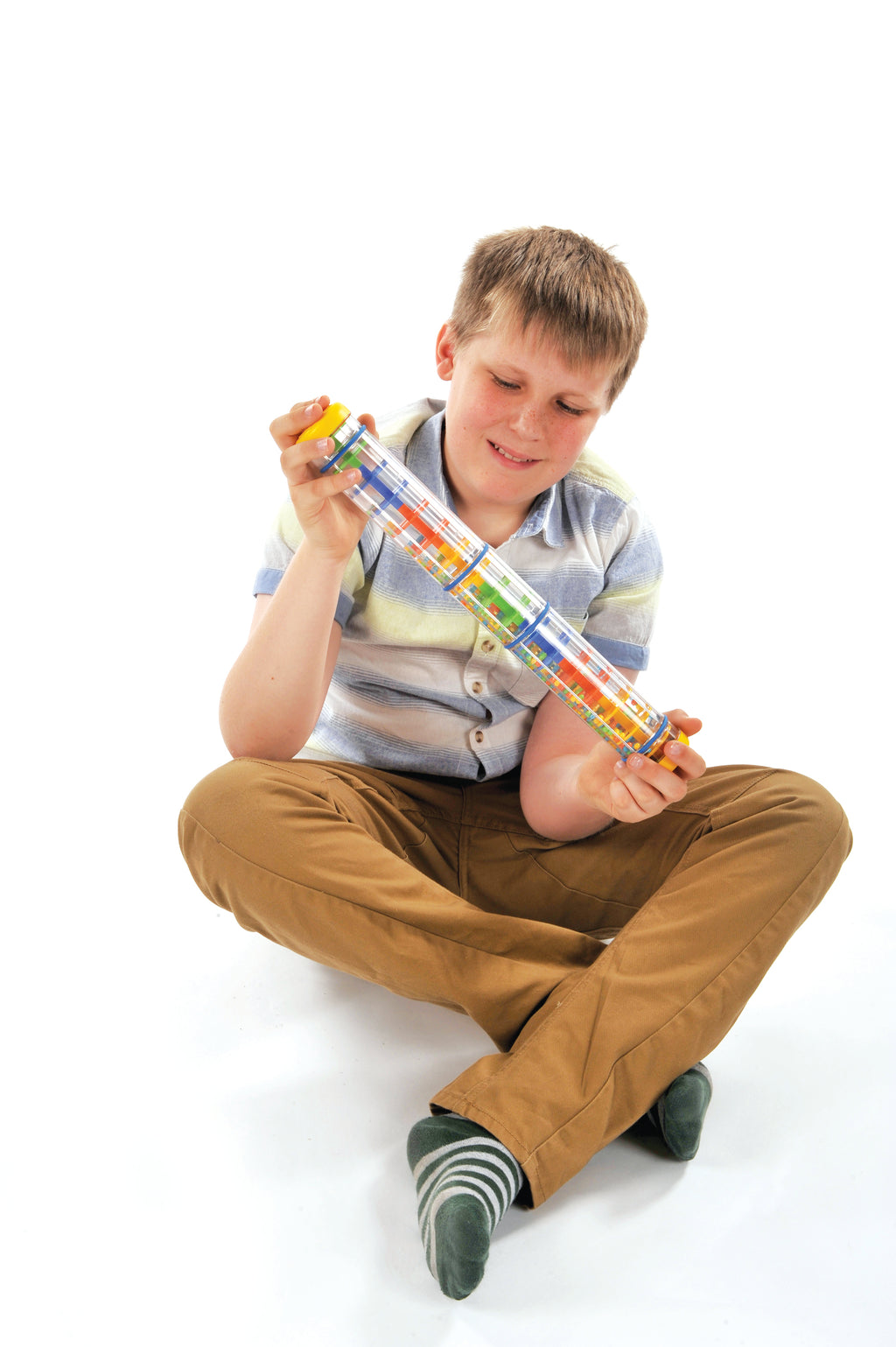 Child using Spectacular Rainstick