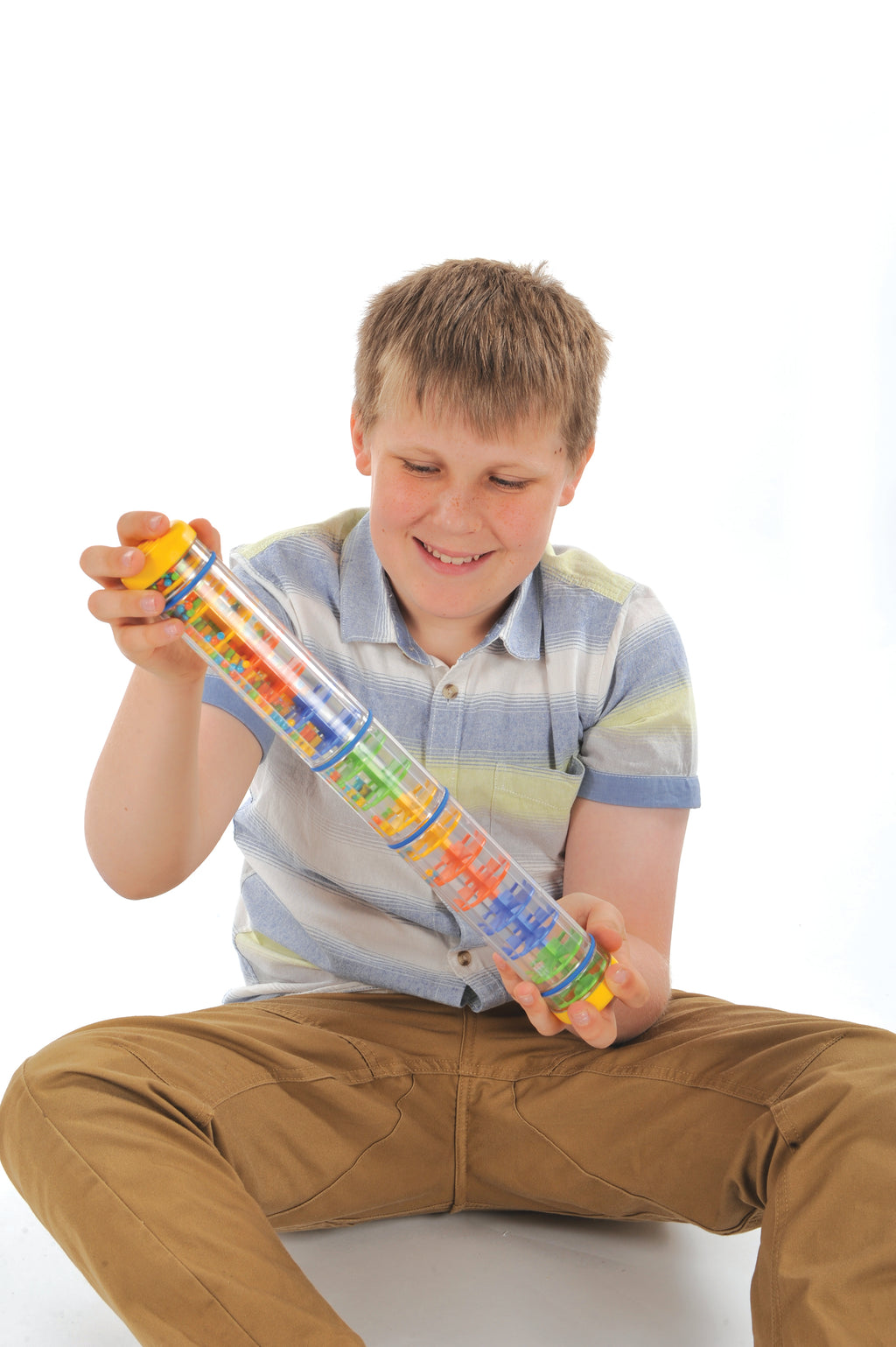 Child using Spectacular Rainstick