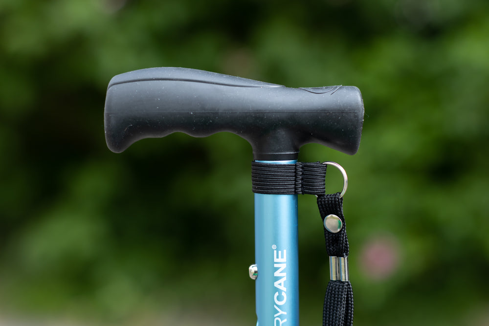 A close up of the handle on a blue Hurrycane Freestanding Walking Stick