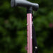 A close up of the height adjustable section on a pink Hurrycane Freestanding Walking Stick