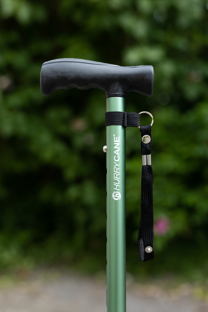 A close up of a green Hurrycane Freestanding Walking Stick
