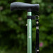 A close up of a green Hurrycane Freestanding Walking Stick