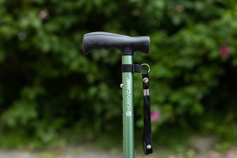 A close up of a green Hurrycane Freestanding Walking Stick