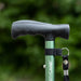 A close up of the handle on a green Hurrycane Freestanding Walking Stick