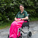 Carol from ability superstore with a pink wheelchair apron