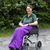 Carol from ability superstore with a purple wheelchair apron