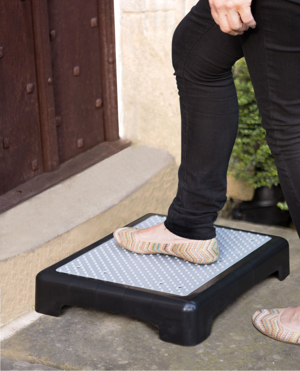 Someone putting their foot on the Outdoor Step