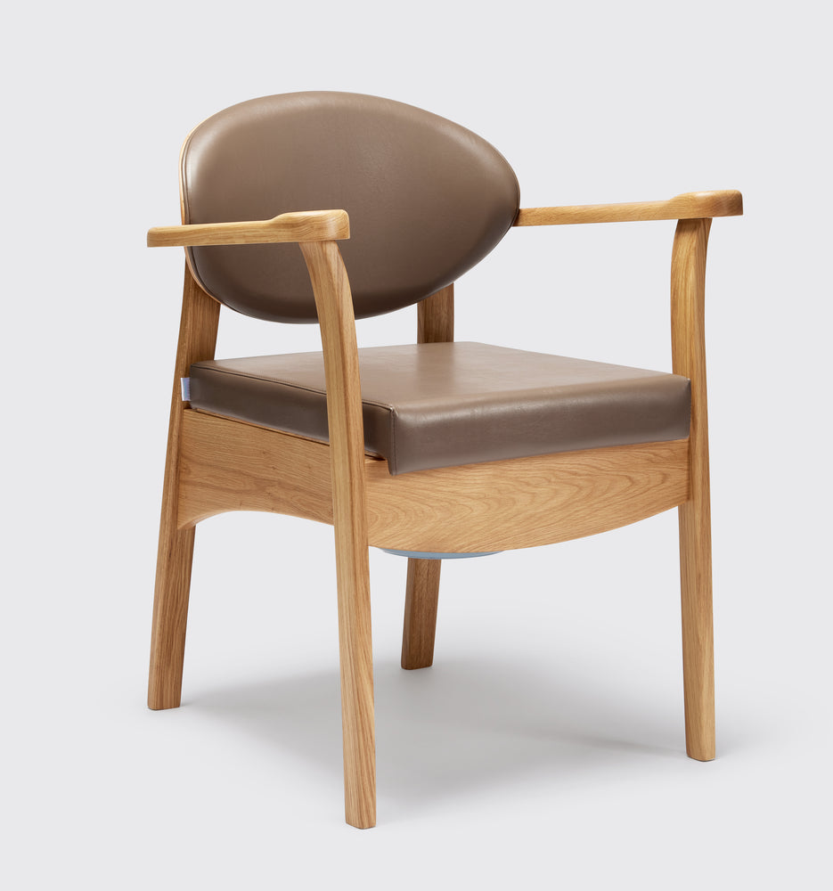 the image shows the mole coloured oak commode chair