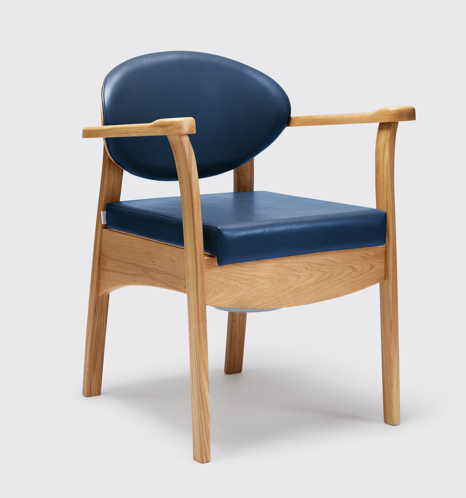 the image shows the navy blue oak commode chair