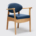 the image shows the navy blue oak commode chair
